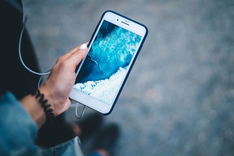 girl-holding-digital-cellular-gadget-with-ocean-im-2023-11-27-04-57-42-utc (1)